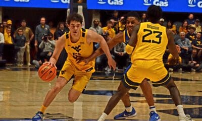 WVU Basketball Treysen Eaglestaff driving with ball against Pitt in Backyard Brawl