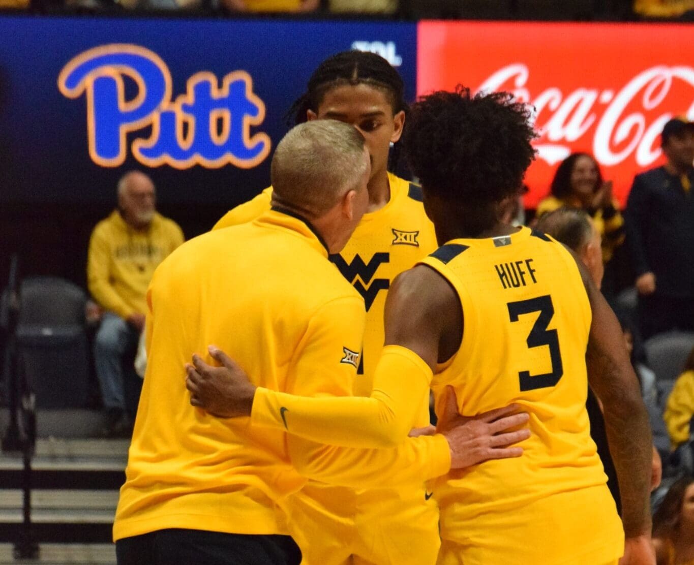 WVU Basketball huddle