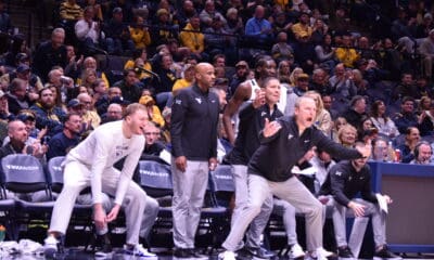 WVU Basketball Darian DeVries, Chester Frazier and Tucker DeVries celebrating