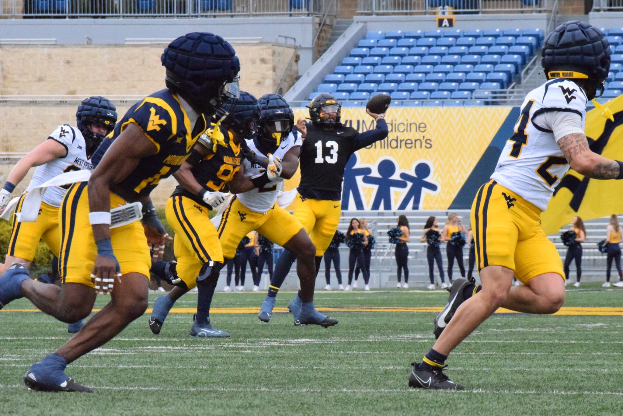 WVU Football Jaylen Henderson throwing to Rodney Gallagher