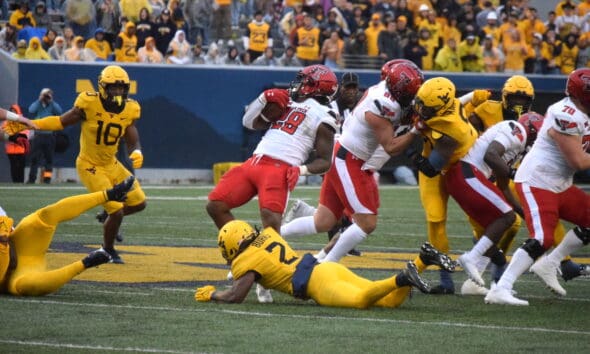 Aubrey Burks and WVU Defense tackling against Texas Tech
