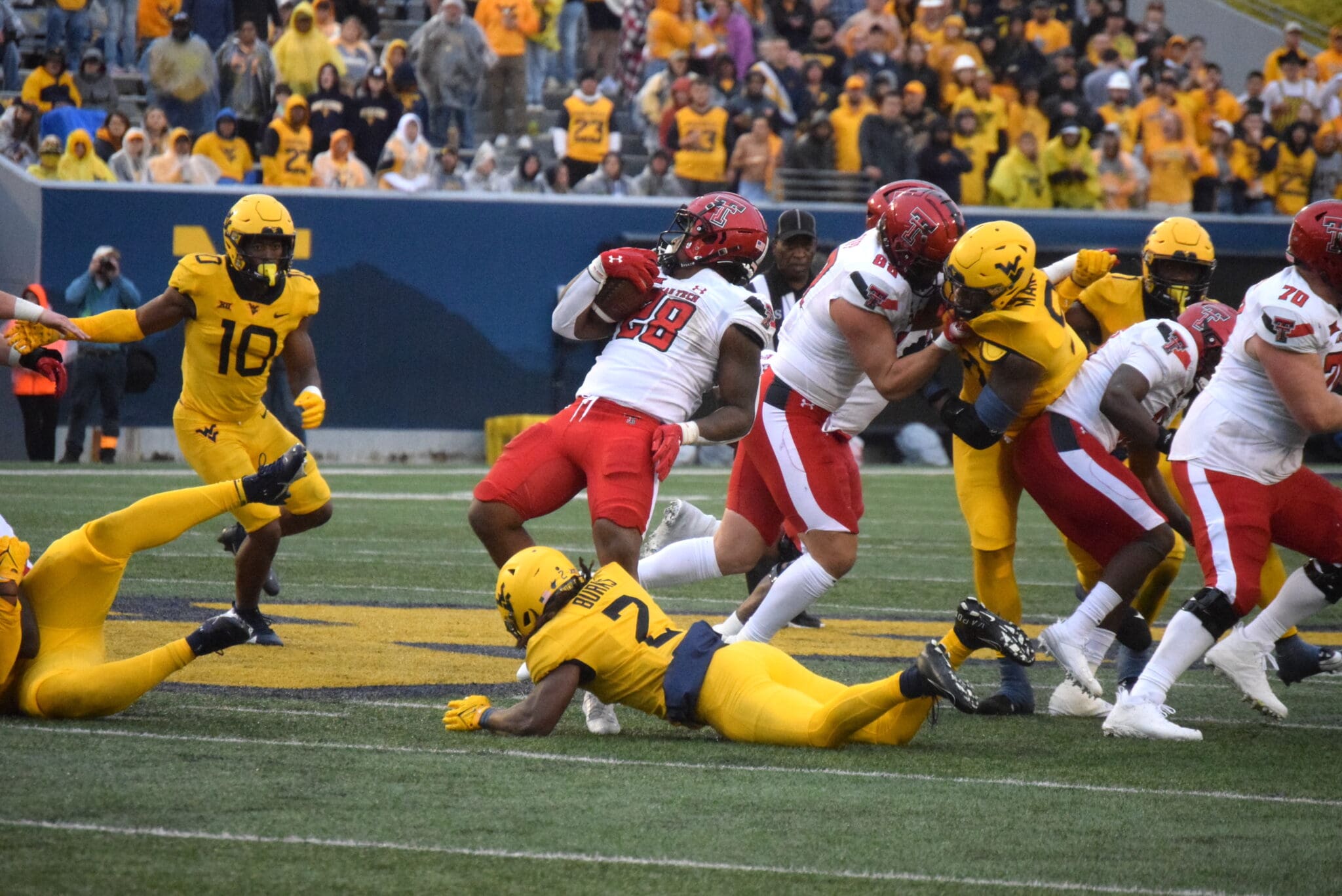 Aubrey Burks and WVU Defense tackling against Texas Tech