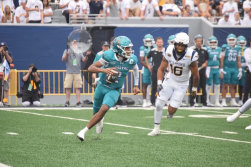 Coastal Carolina QB Deuce Bailey being chased by WVU defender