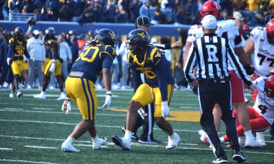 WVU Football players celebrate against Cincinnati