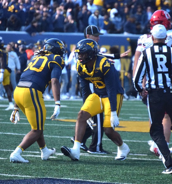 WVU Football players celebrate against Cincinnati
