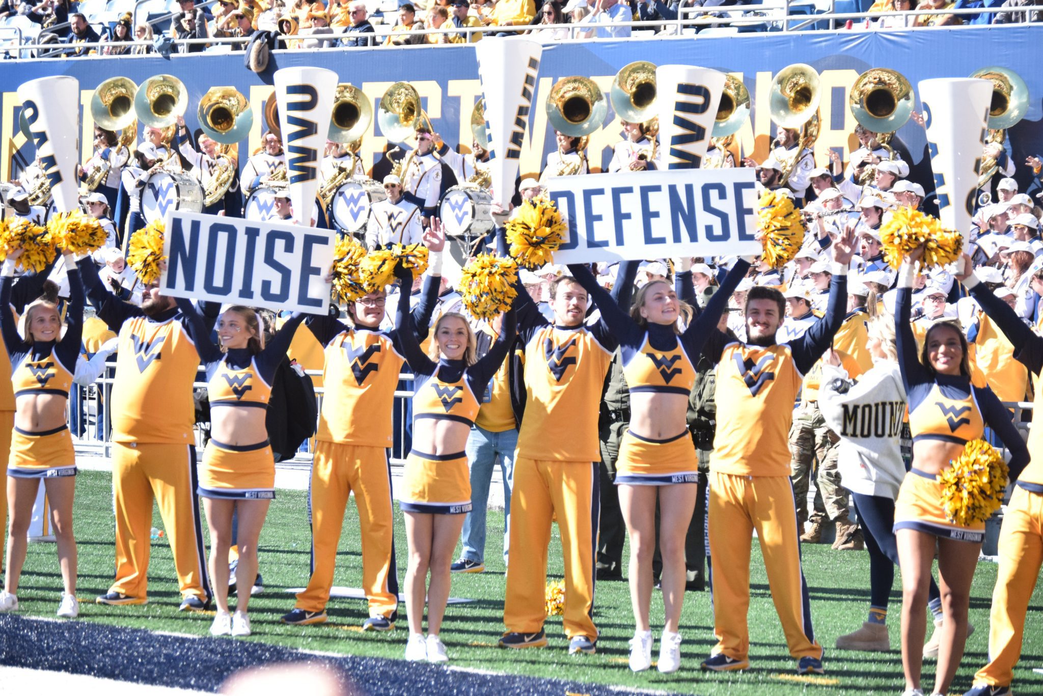 WVU Football Cheerleaders Defense Signs STOCK photo
