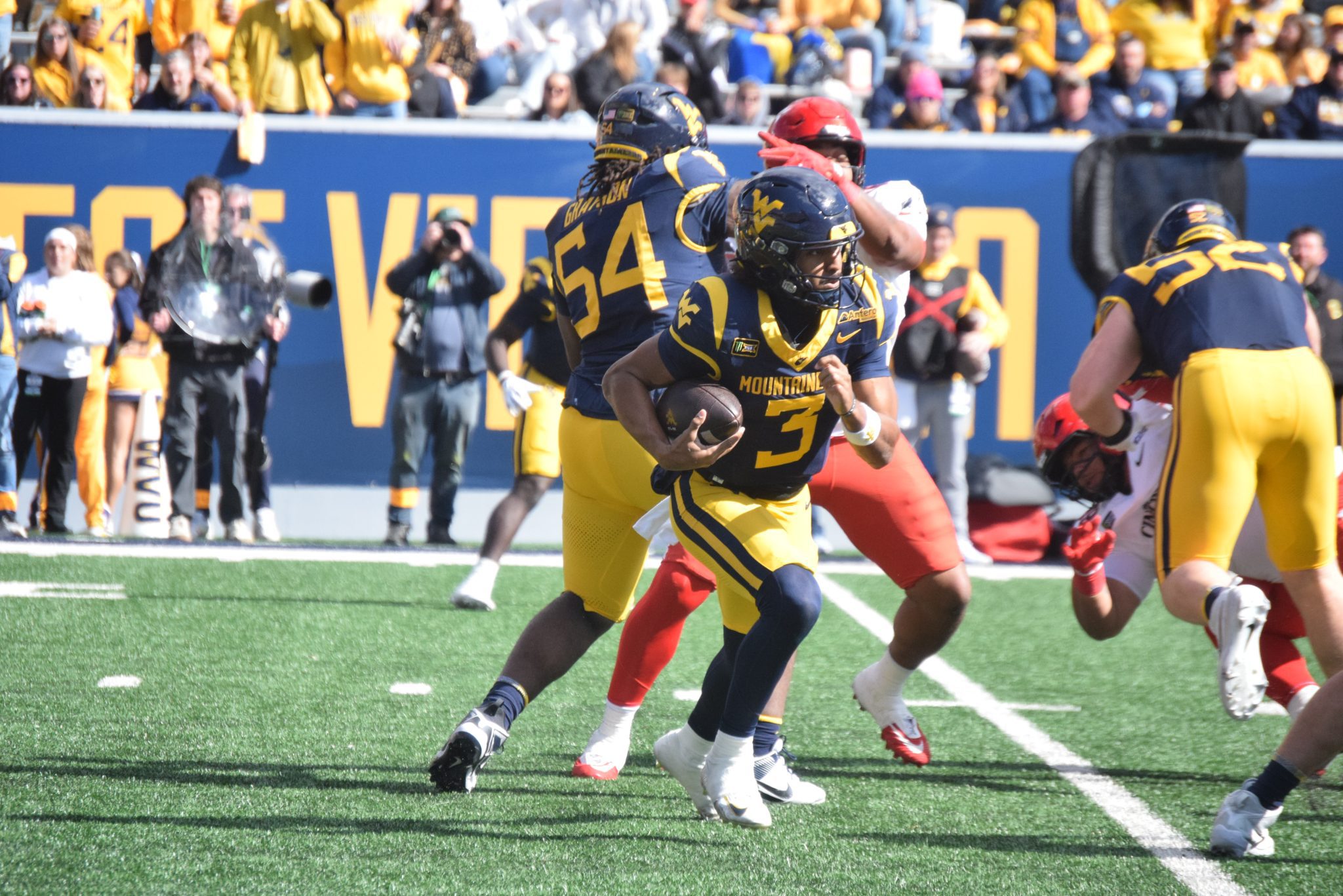 WVU QB Michael Hawkins Jr with Quarterback Keeper