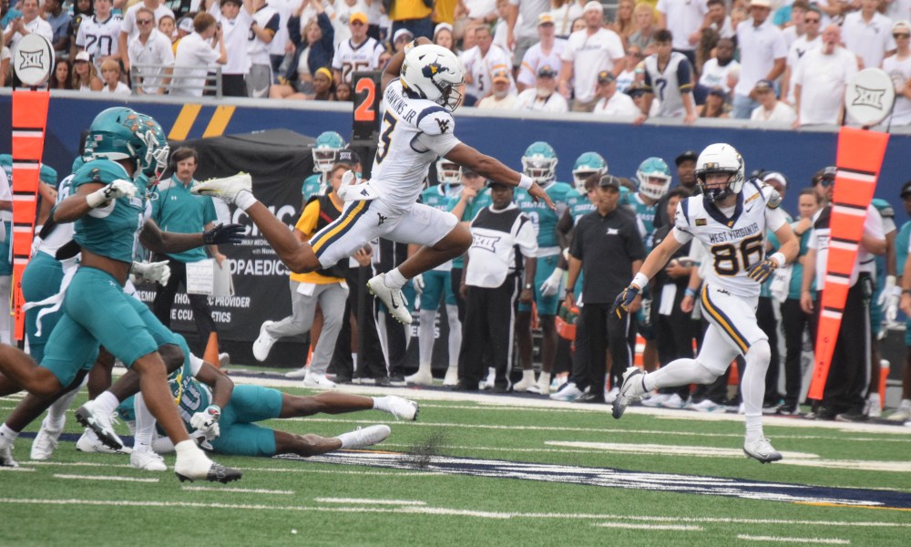 WVU Football QB Michael Hawkins Jr. Goes airborne versus Costal Carolina