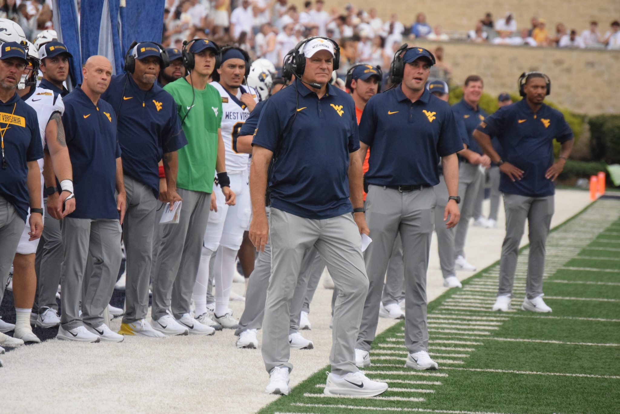 WVU Football HC Rich Rodriguez and coaches on the sideline