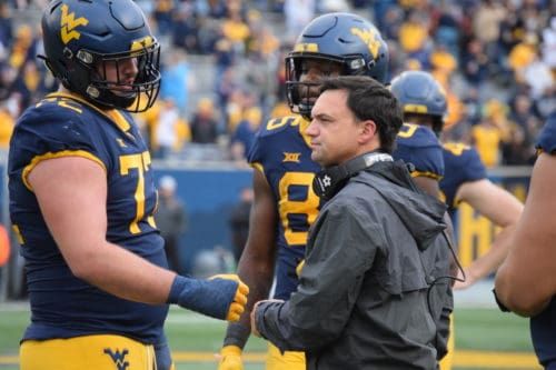 WVU football head coach Neal Brown and offensive lineman Doug Nester