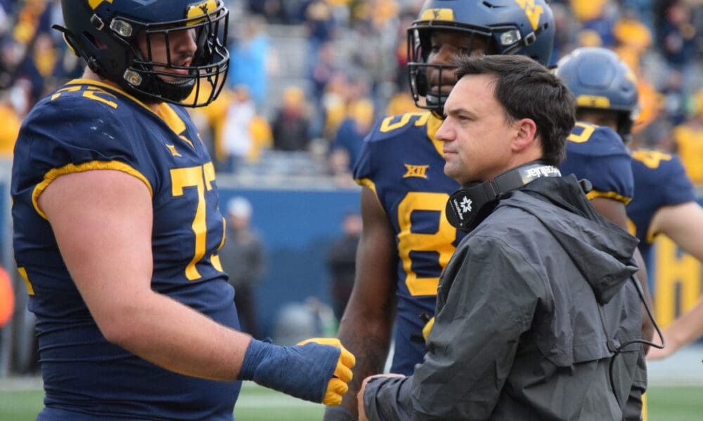 WVU Football head coach Neal Brown and offensive lineman Doug Nester