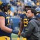 WVU Football head coach Neal Brown and offensive lineman Doug Nester