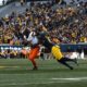 WVU Football DL Tyrin Bradley making tackle against Oklahoma State/
