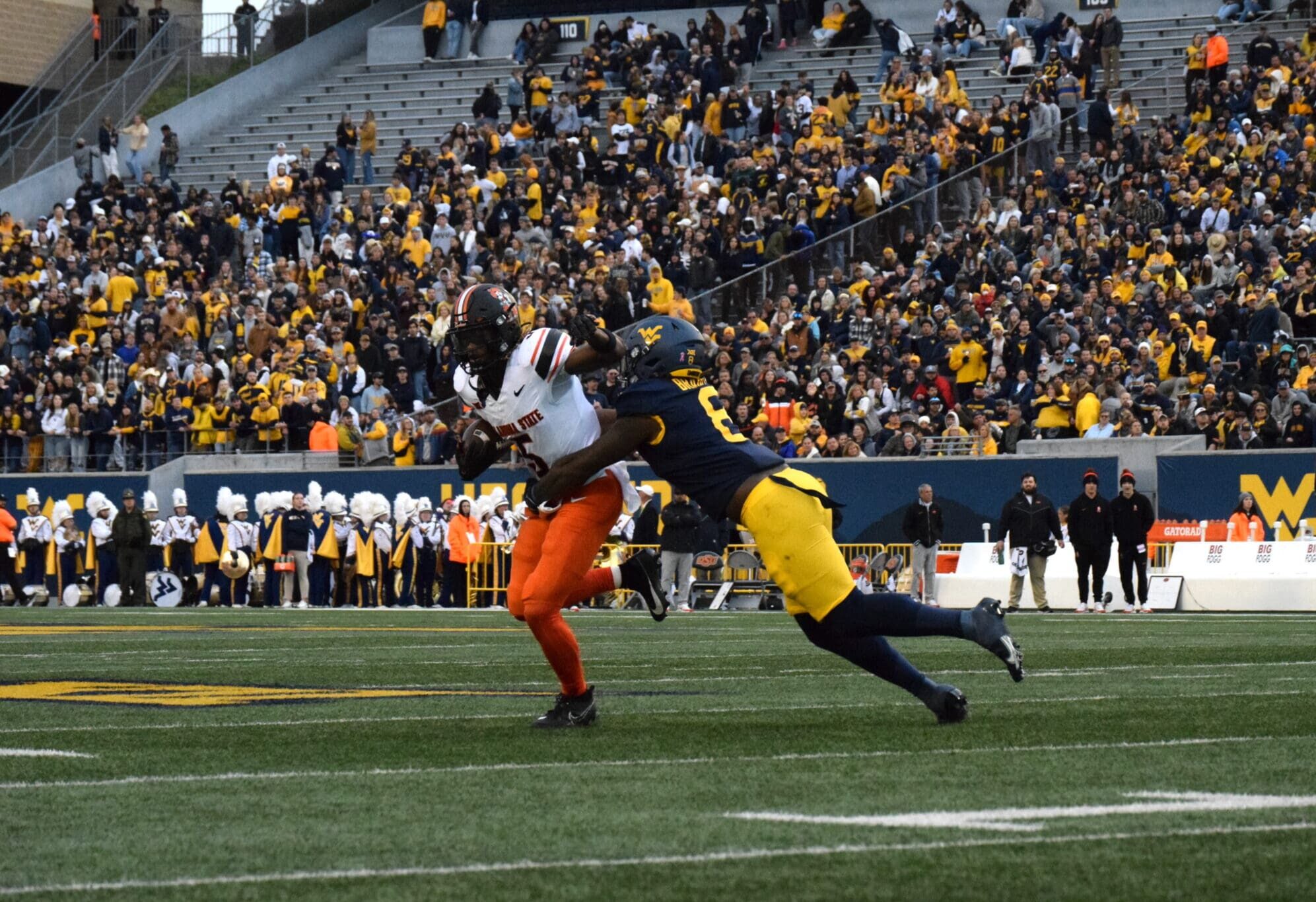 WVU Football DL Tyrin Bradley making tackle against Oklahoma State/