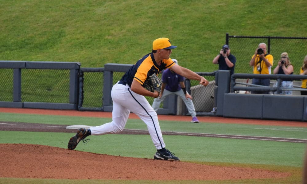 WVU Baseball pitcher Ben Hampton delivers a pitch.