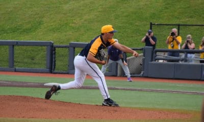 WVU Baseball pitcher Ben Hampton delivers a pitch.