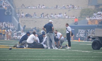 WVU Football HC Rich Rodriguez on field during Darius Wiley's injury