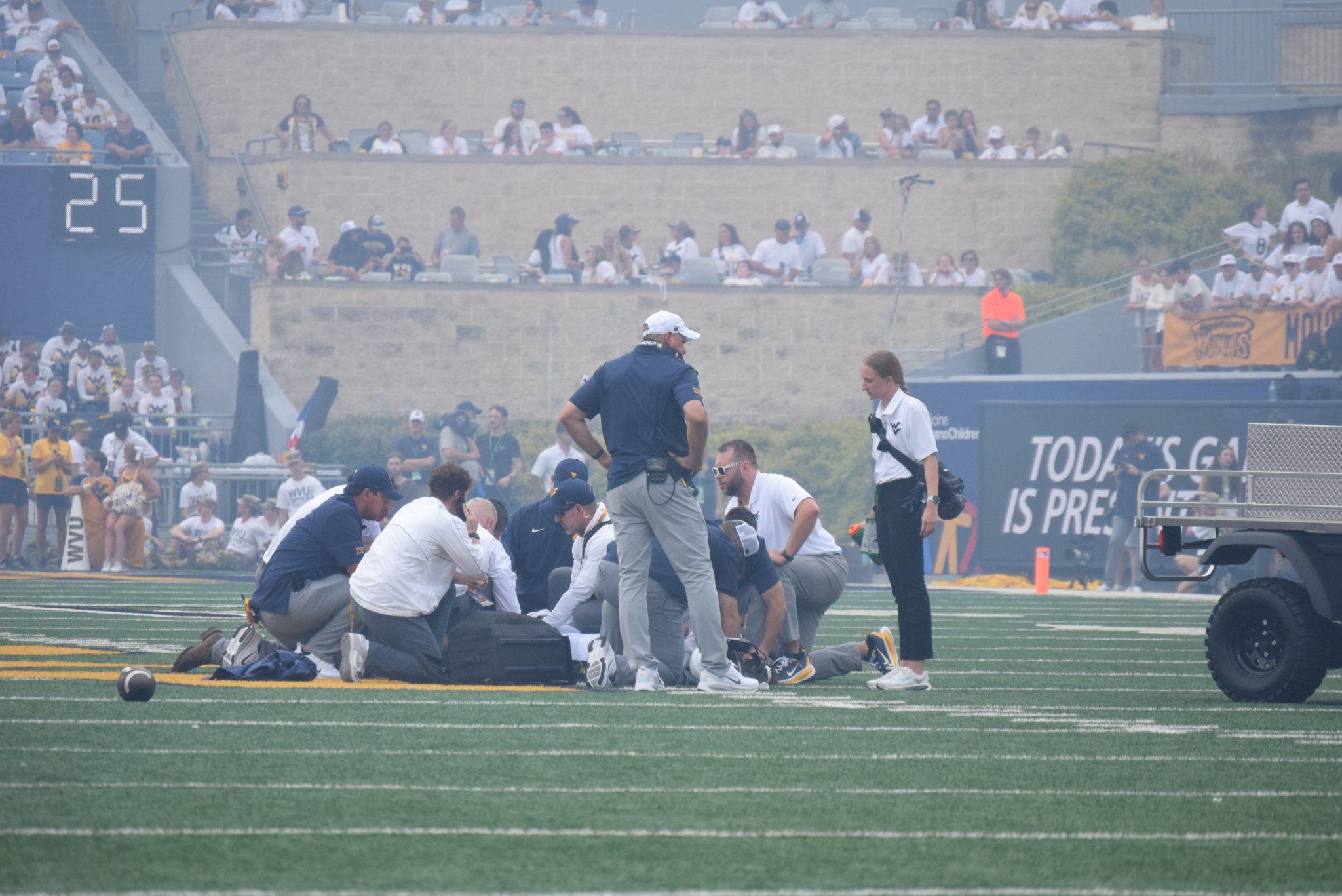 WVU Football HC Rich Rodriguez on field during Darius Wiley's injury