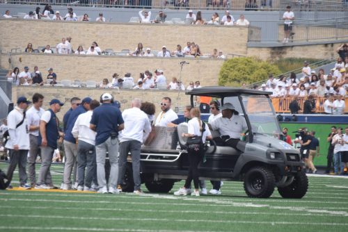 WVU Football HC Rich Rodriguez on field as Darius Wiley is carted off