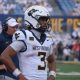 WVU Football QB Michael Hawkins with Rich Rodriguez behind him