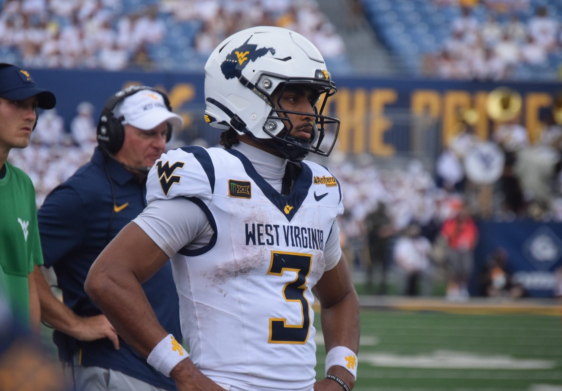 WVU Football QB Michael Hawkins with Rich Rodriguez behind him
