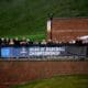 WVU Baseball fans behind NCAA Regional sign