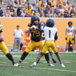 WVU Football DB Geimere Latimer rushing during scrimmage