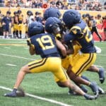 WVU Football CB Nick Taylor and others make a tackle during scrimmage