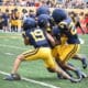 WVU Football CB Nick Taylor and others make a tackle during scrimmage