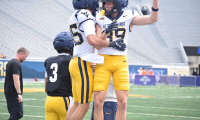 WVU Football Kicker Peter Notaro celebrating with a teammate during a scrimmage
