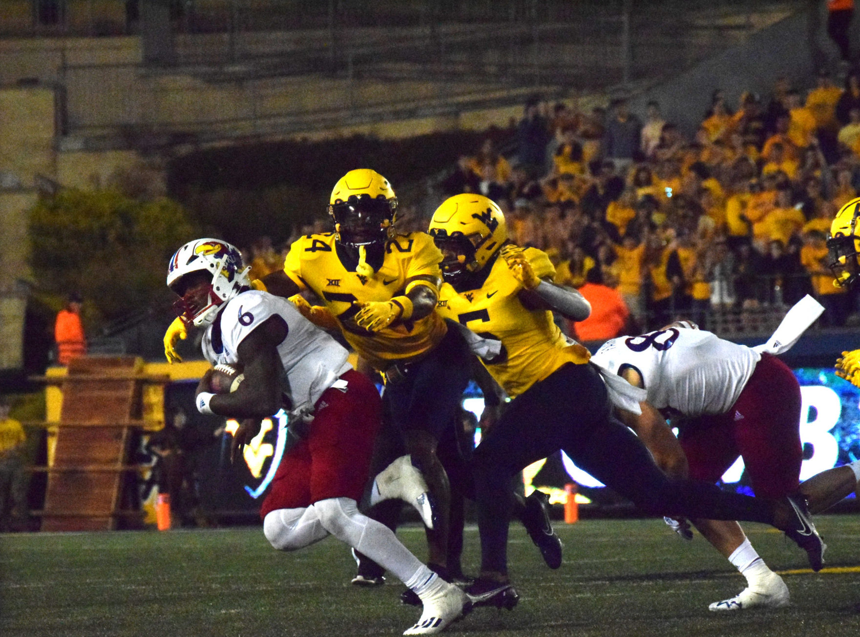 Jalon Daniels, Bryant lead Kansas Jayhawks over WVU 55-42 in OT