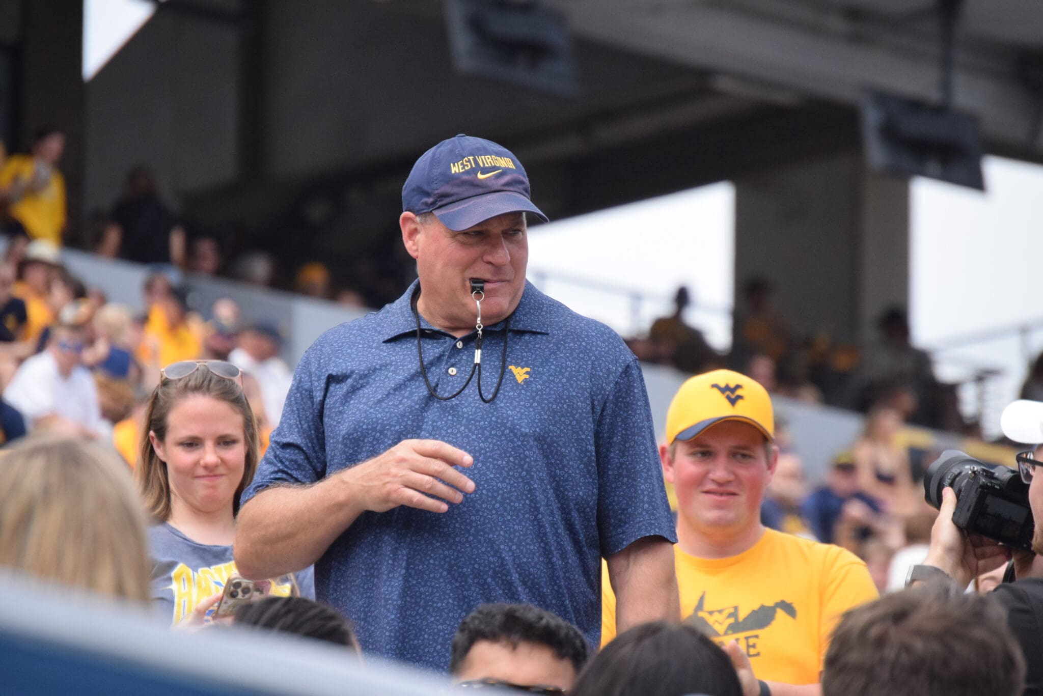 WVU Football HC Rich Rodriguez with fans during spring scrimmage