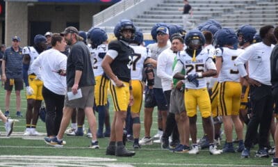 WVU Football QB Michael Hawkins and WR Armoni Weaver-Bomar with teammates during scrimmage
