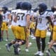 WVU Football players, including TaRon Francis at scrimmage