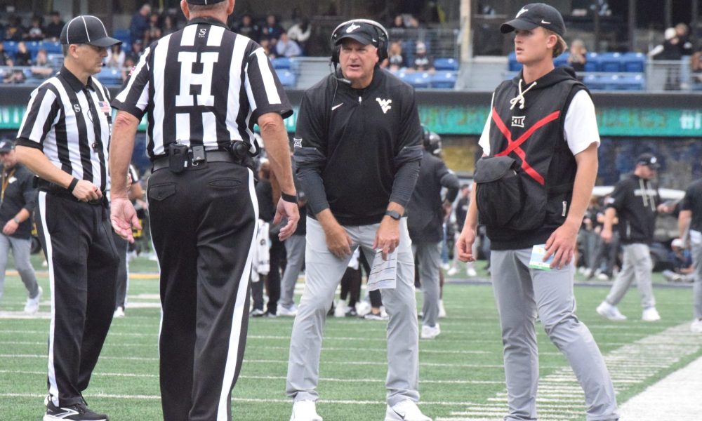 WVU Football Head Coach Rich Rodriguez Talks with Referees