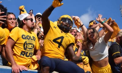 Leddie Brown with WVU Football fans