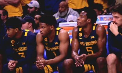 WVU Basketball team on bench