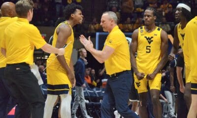 WVU Basketball Head Coach Darian DeVries and Bench