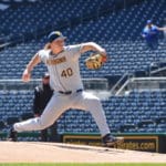 WVU Baseball pitcher Aidan Major delivers a pitch.