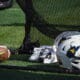 WVU Football white helmets and football stock