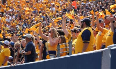 WVU Football fans waving towels