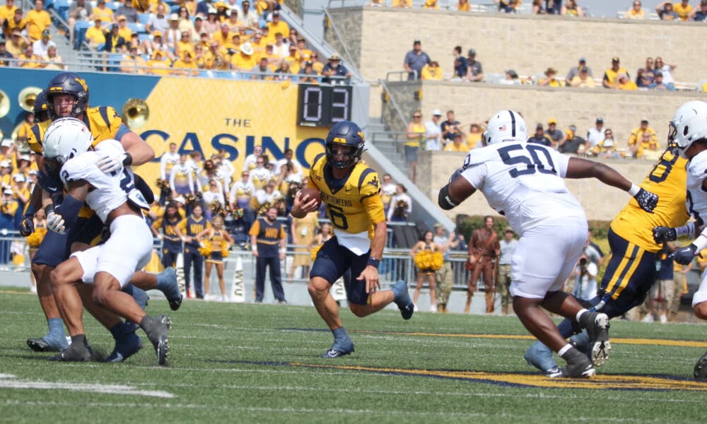 WVU Football QB Garrett Greene scrambling against Penn State