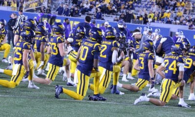 WVU Football team stretching