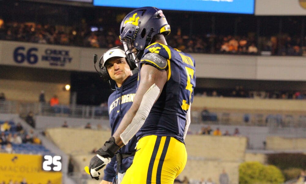 WVU Football Head Coach Neal Brown and Sean Martin