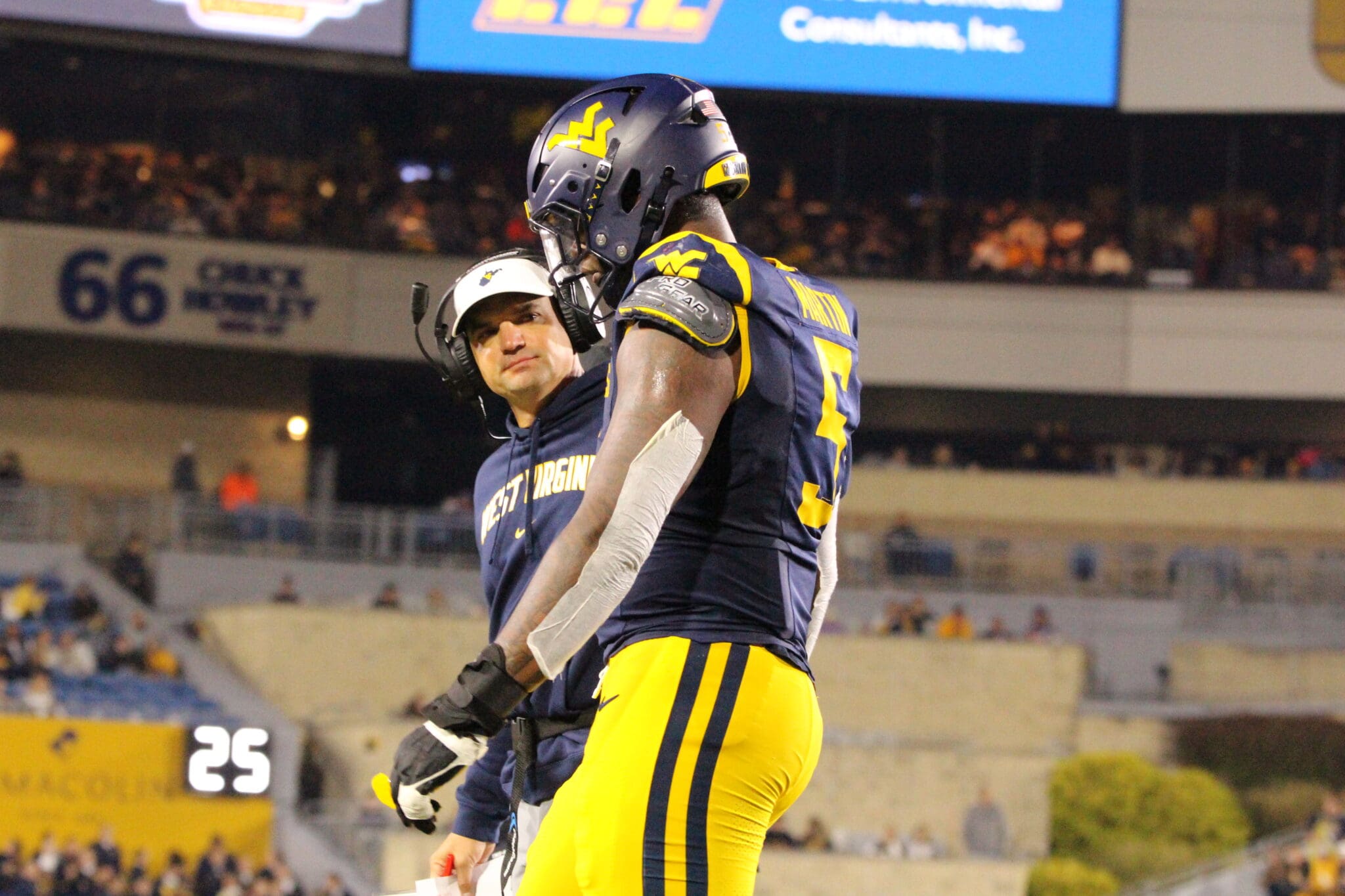 WVU Football Head Coach Neal Brown and Sean Martin