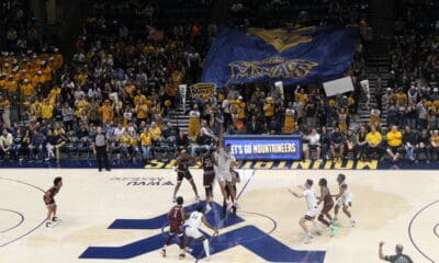 WVU Basketball crowd at Coliseum with Maniacs banner against Missouri State