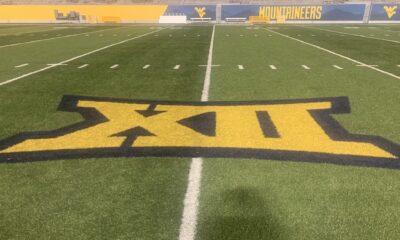 Big 12 logo on WVU football field stock