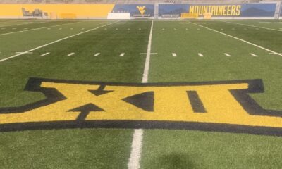 Big 12 logo on WVU football field stock