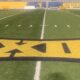 Big 12 logo on WVU football field stock
