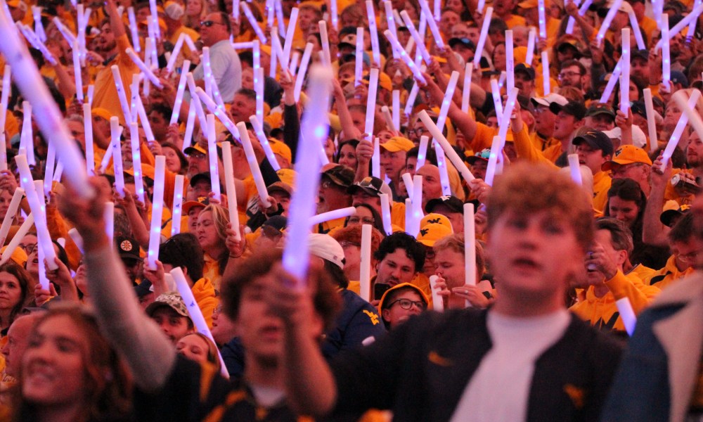 WVU Football crowd at night game stock